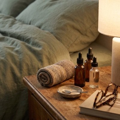 A bedside table of oils and balms already tried